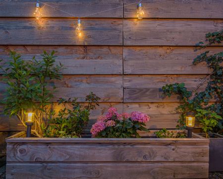 Raised bed with solar powered garden lights