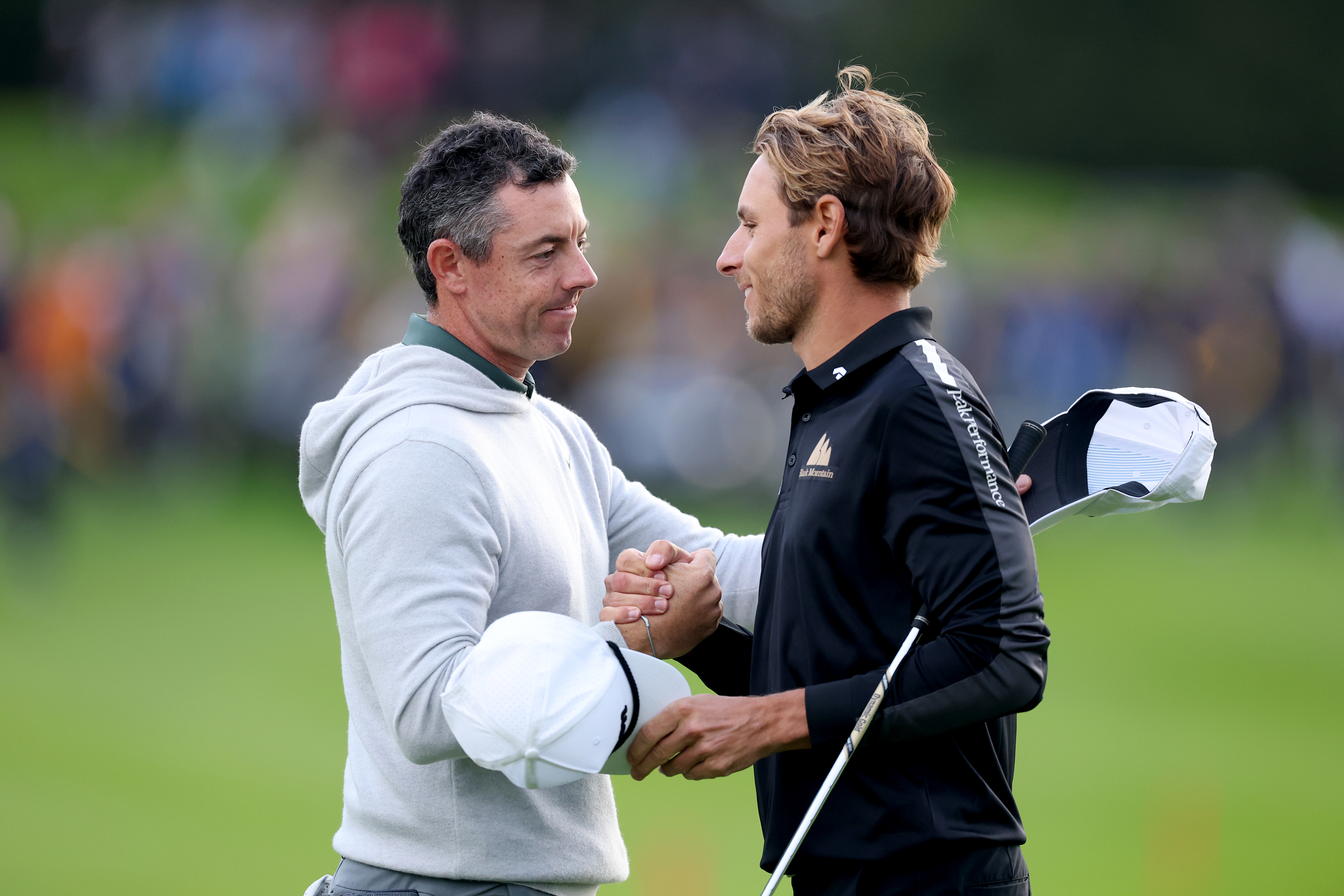 Rory McIlroy and Joakim Lagergren shake hands