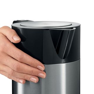 Hand touching the Bosch Sky kettle