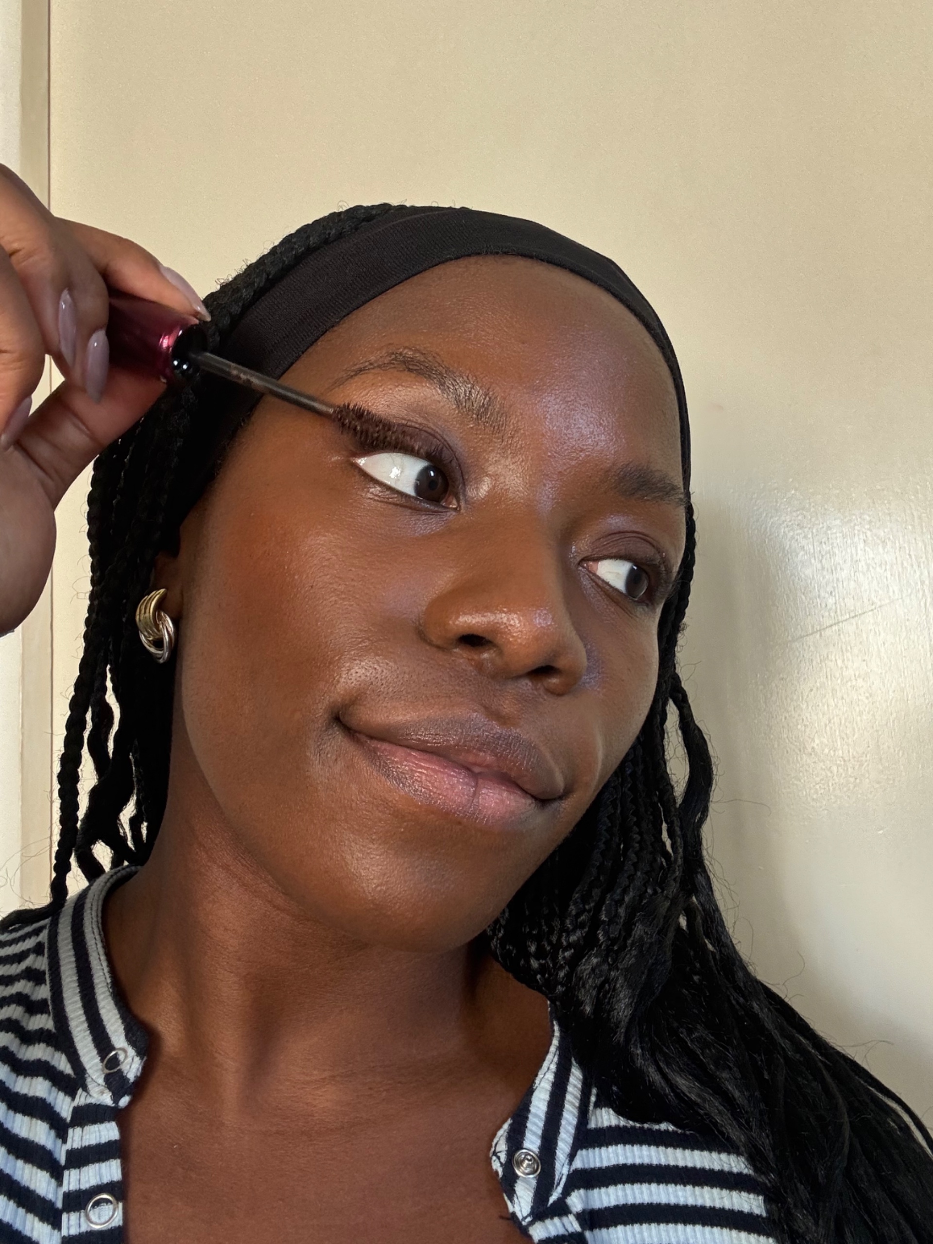 Ata-Owaji Victor applying mascara to top lash