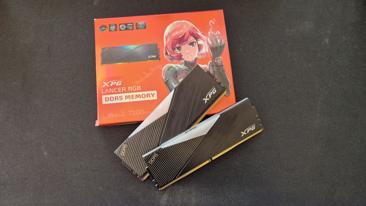 XPG Lancer RGB DDR5 on a black surfave sitting on top of its red glossy box