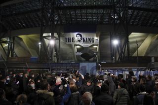 People gather outside Napoli's San Paolo Stadium to remember Diego Maradona
