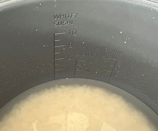 A closeup of the measurements inside the bowl of the Cosori 5-Quart Rice Cooker