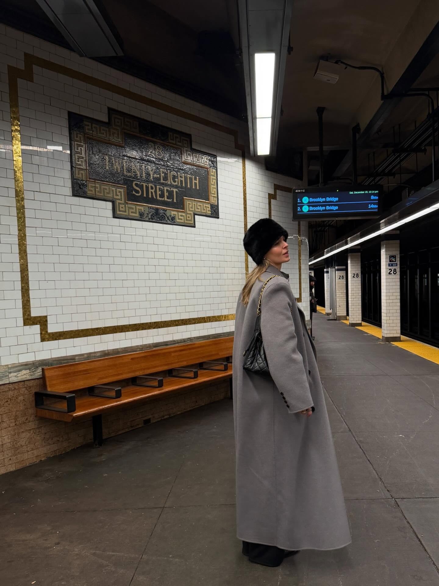 Fashion person Hollie Mercedes wears a best long wool coat. She wears a The Frankie Shop Gaia Coat.