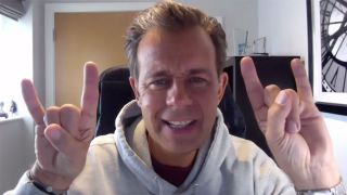 A photograph of Pat Sharp throwing the horns