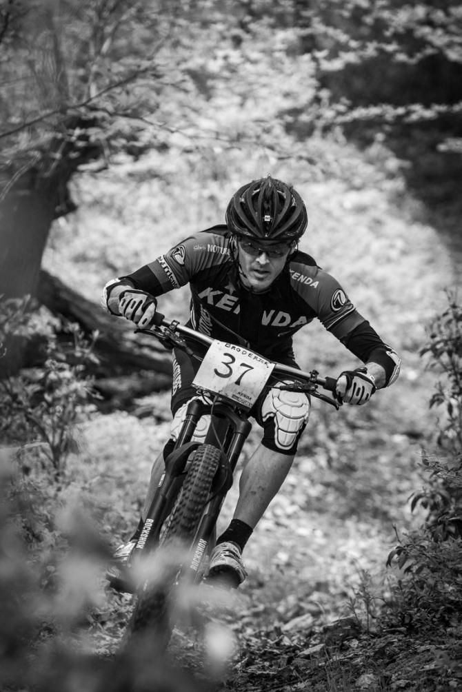Michael Broderick in a tunnel of leaves as he descends in the enduro competition