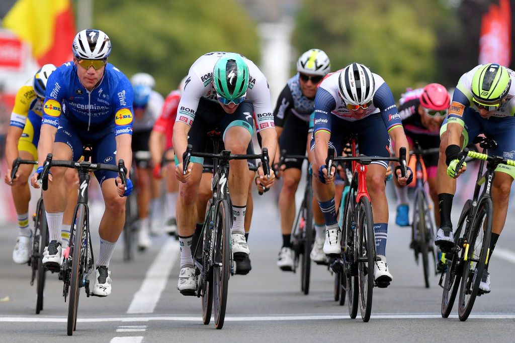 TOURNAI BELGIUM SEPTEMBER 29 LR Fabio Jakobsen of Netherlands and Team Deceuninck QuickStep Jordi Meeus of Belgium and Team Bora Hansgrohe Mads Pedersen of Denmark and Team Trek Segafredo sprint to win during the 80th Euromtropole Tour 2021 a 1776km race from La Louvire to Tournai Eurometrotour on September 29 2021 in Tournai Belgium Photo by Luc ClaessenGetty Images