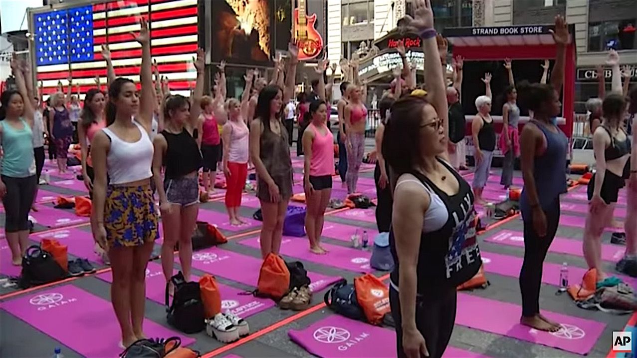 People celebrate International Yoga Day in Times Square