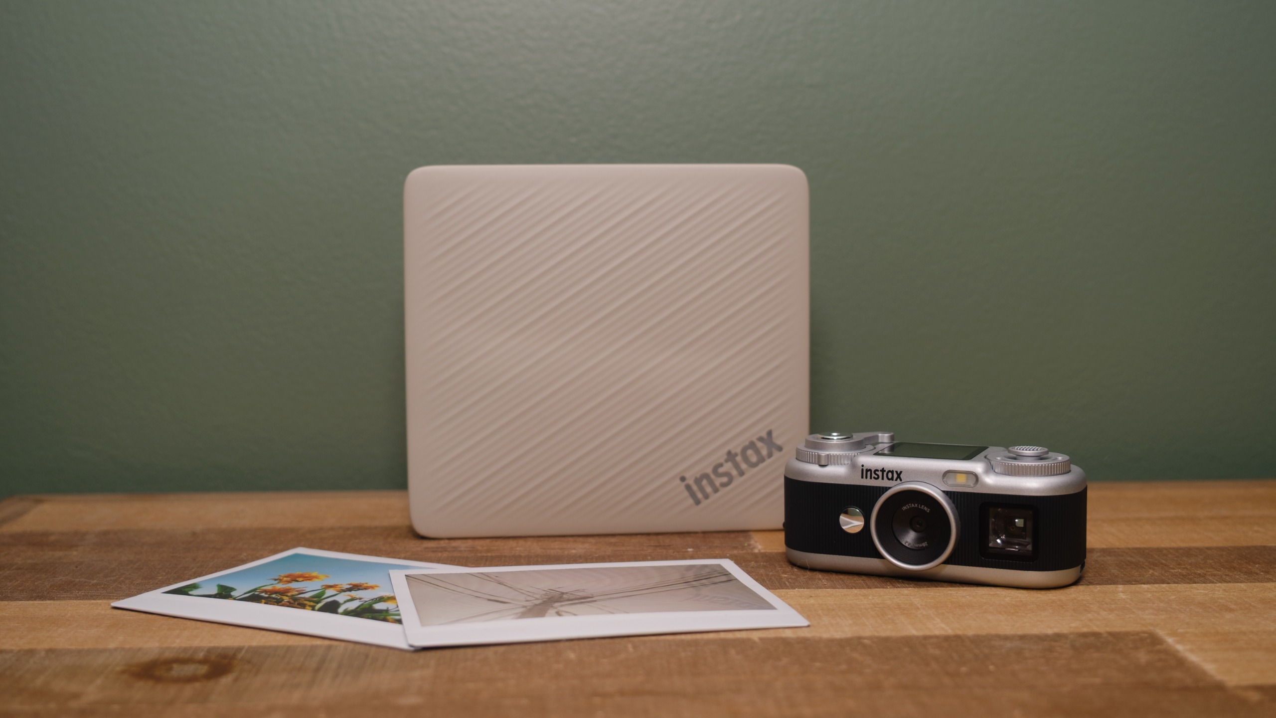 The Fujifilm Instax Link Wide 2 photo printer on a bookshelf