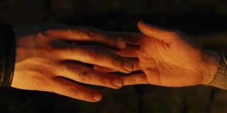 Kylo and Rey touching hands in The Last Jedi