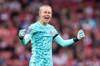 Hannah Hampton of Chelsea celebrates after Mayra Ramirez of Chelsea (not pictured) scores her team's first goal during the Barclays Women's Super League match between Arsenal and Chelsea at Emirates Stadium on October 12, 2024 in London, England.