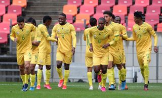Victor Letsoalo celebrates his hat-trick with teammates 