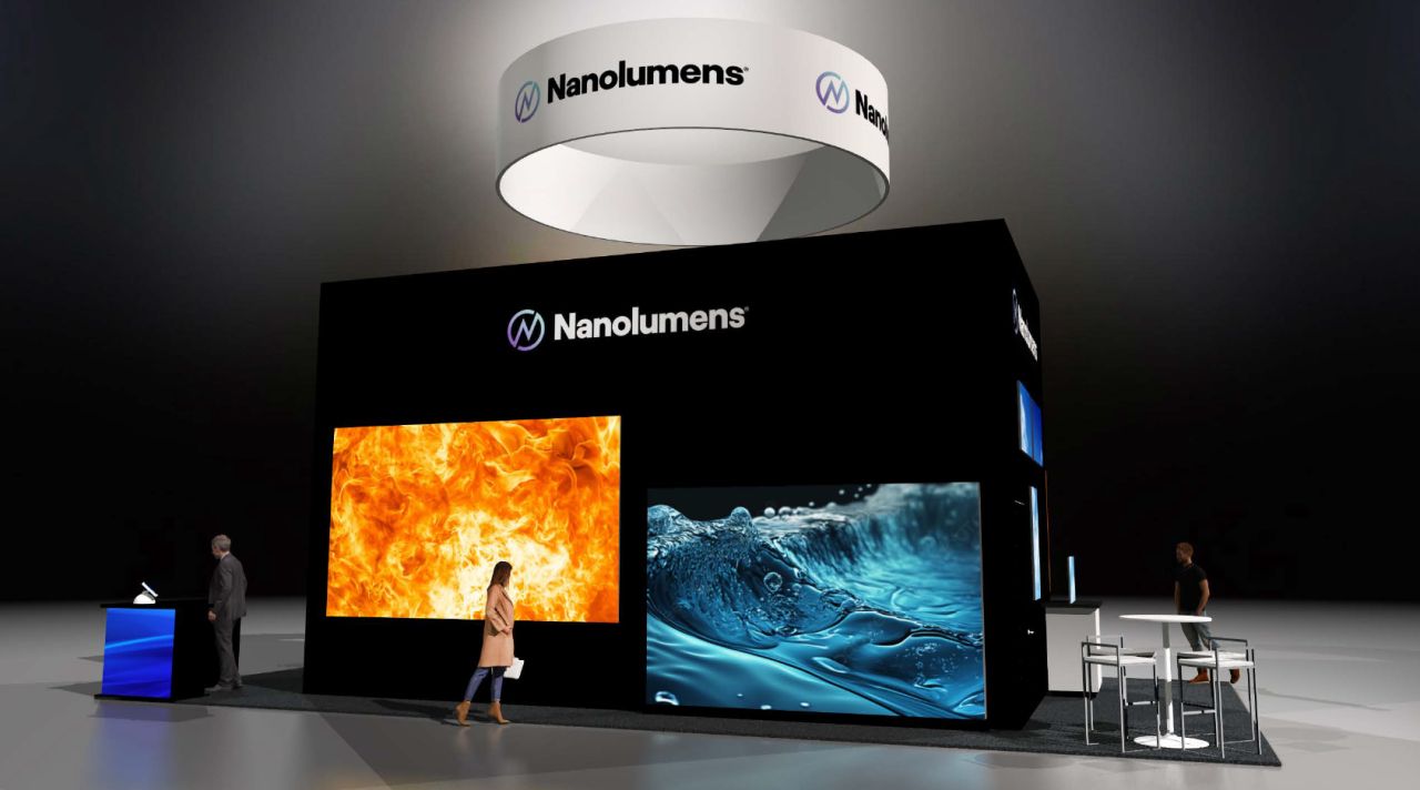 A woman walking past the Nanolumens booth at InfoComm.