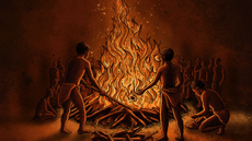 People in front a burning pyre.