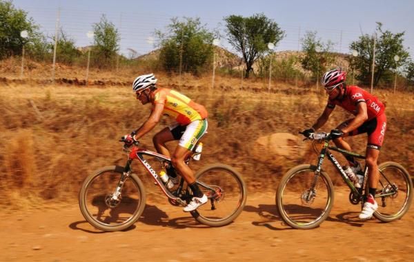 Kevin Evans sets a furious pace to get ride of DCM's Brandon Stewart.