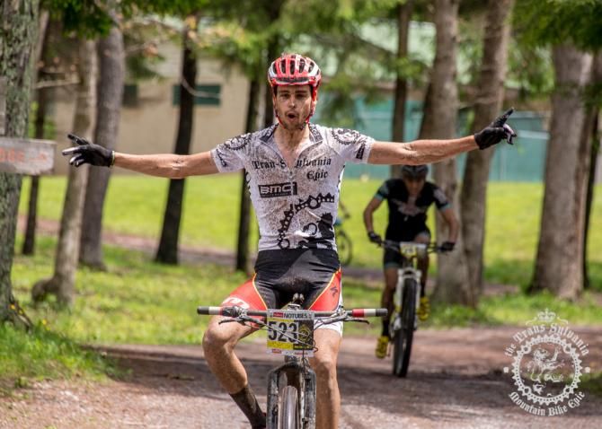 Payson McElveen celebrates his victory as he crosses the finish line of stage 4.