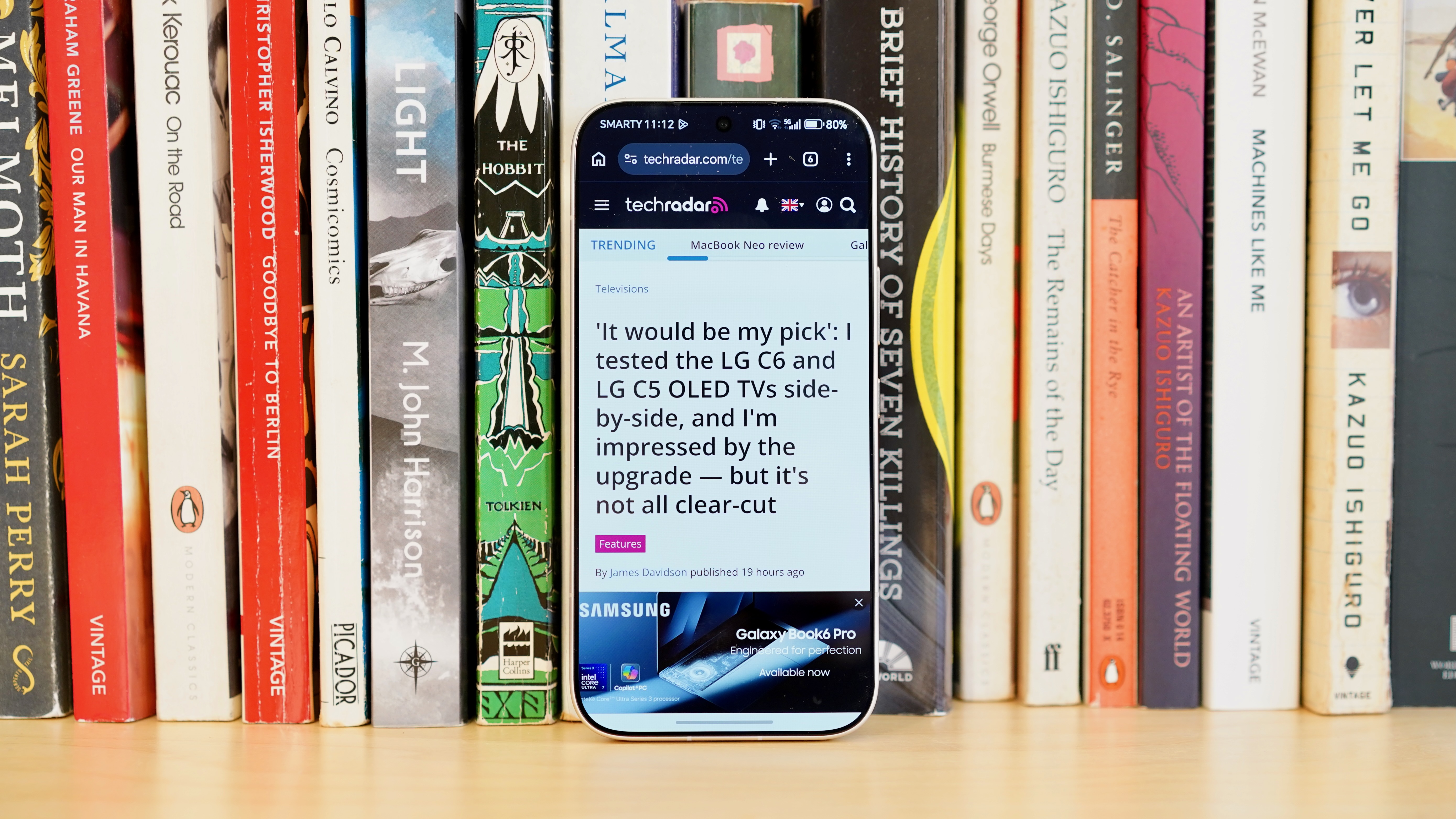 A white Honor 600 Pro resting on a wooden table