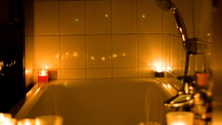 candles surrounding a bath
