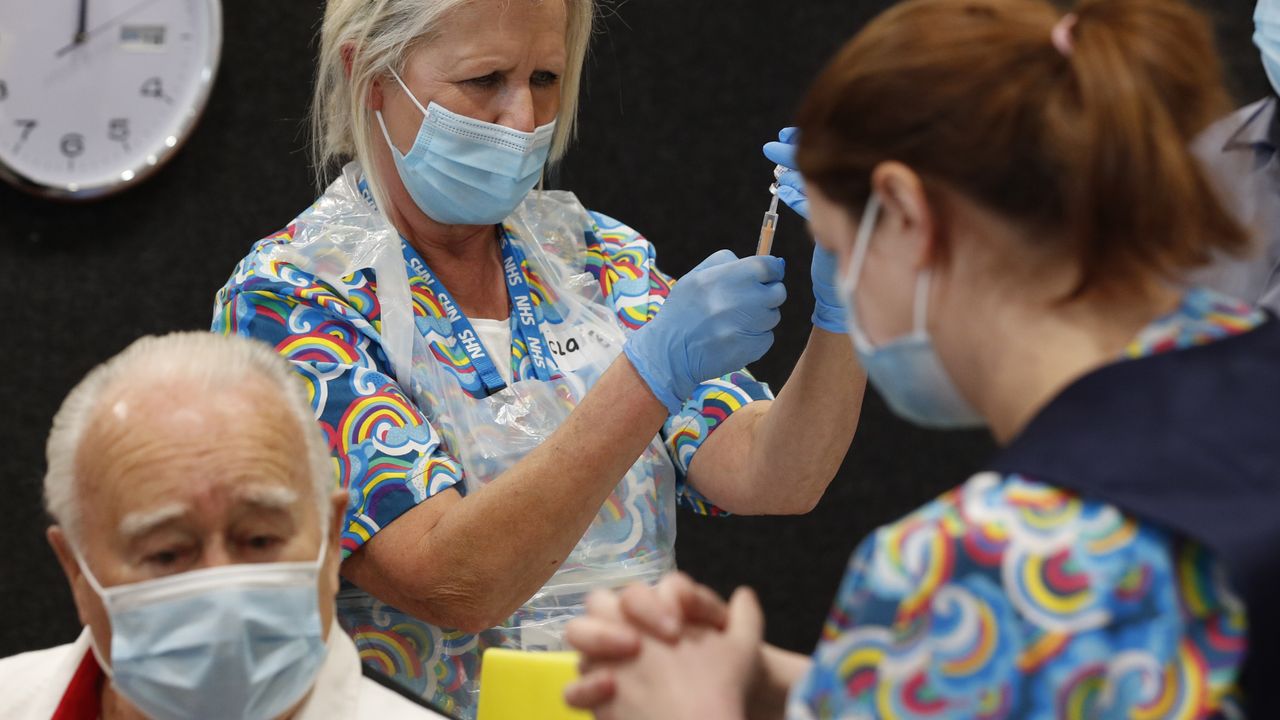 A Covid-19 vaccine is prepared at the Princess Royal Sports Arena.