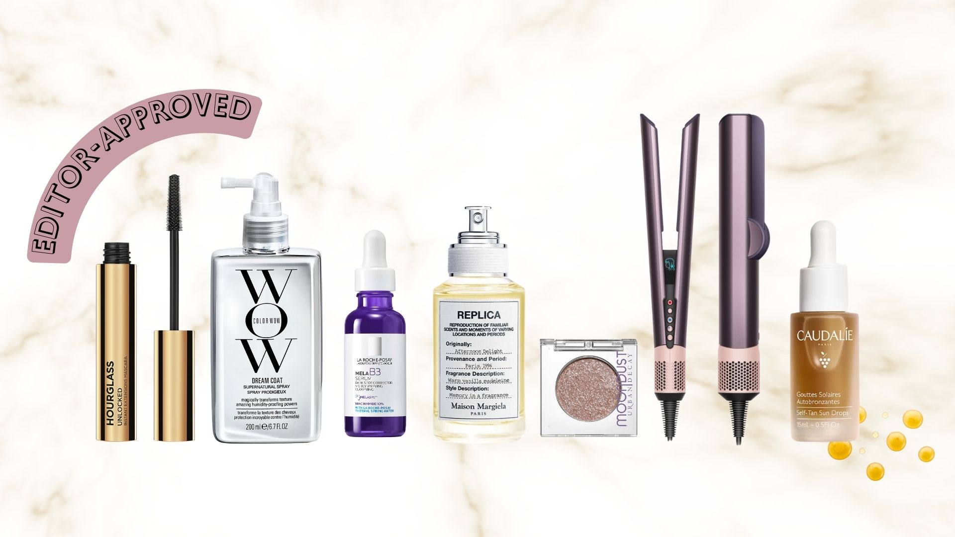 Hourglass Unlocked mascara, Color Wow Dream Coat, La Roche Posay Mela B3 serum, Replica Afternoon Delight perfume, Urban Decay Moondust eyeshadow, Dyson Airstrait and Caudalie face bronzing drops on a white and gold marble-patterned background