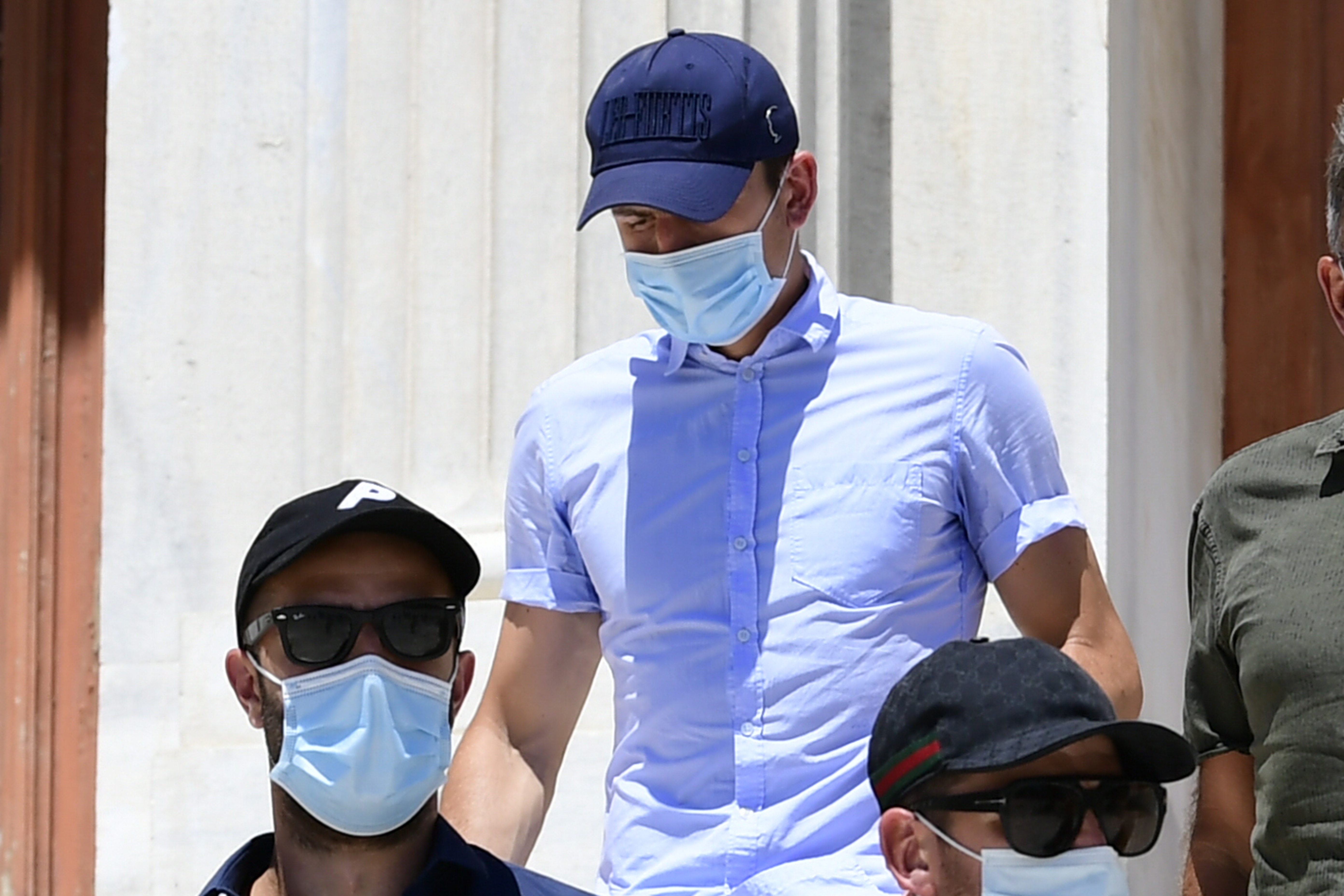 Harry Maguire, centre, leaves a court building on the island of Syros, Greece, on Saturday