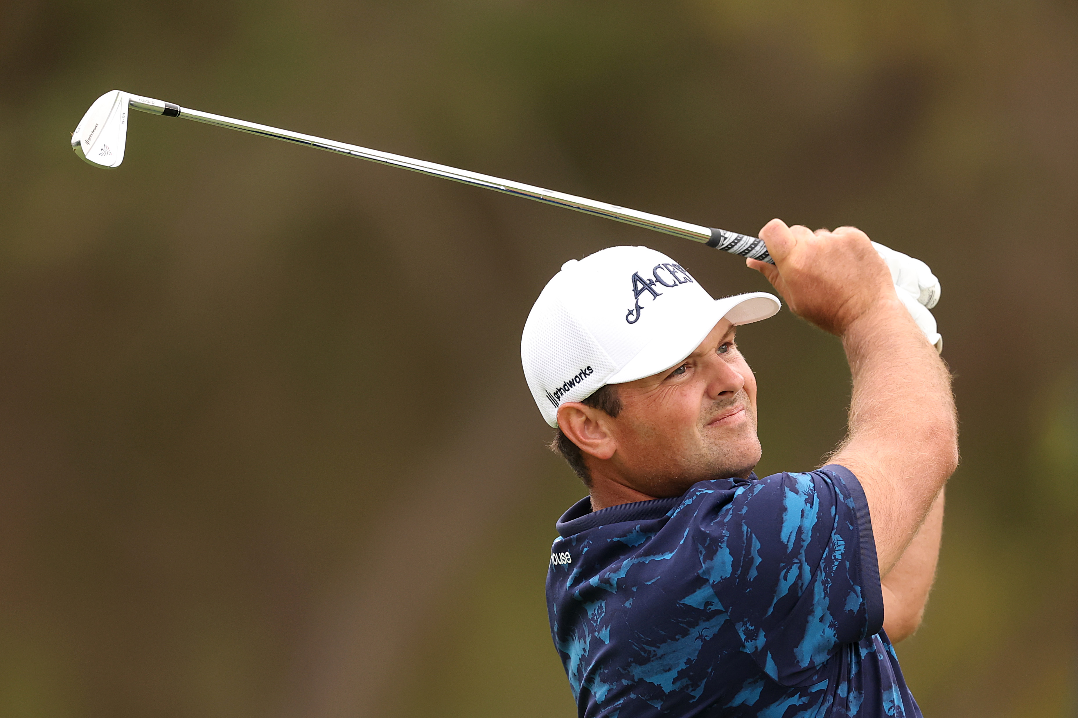 Patrick Reed hits an iron shot