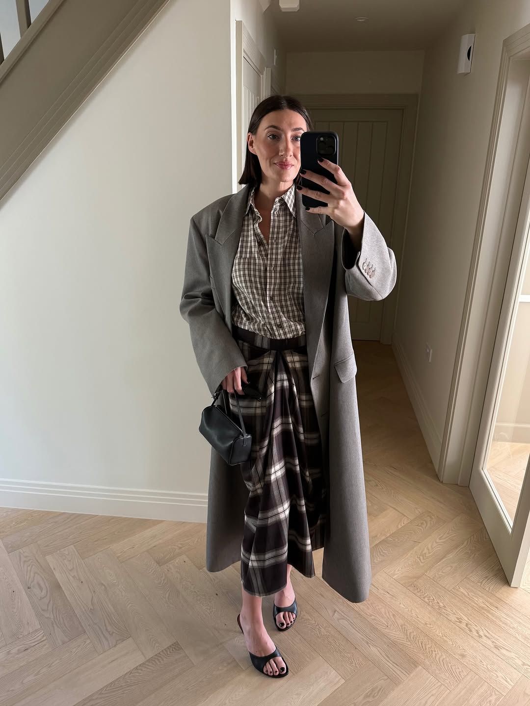 woman wearing plaid maxi skirt outfit 2025
