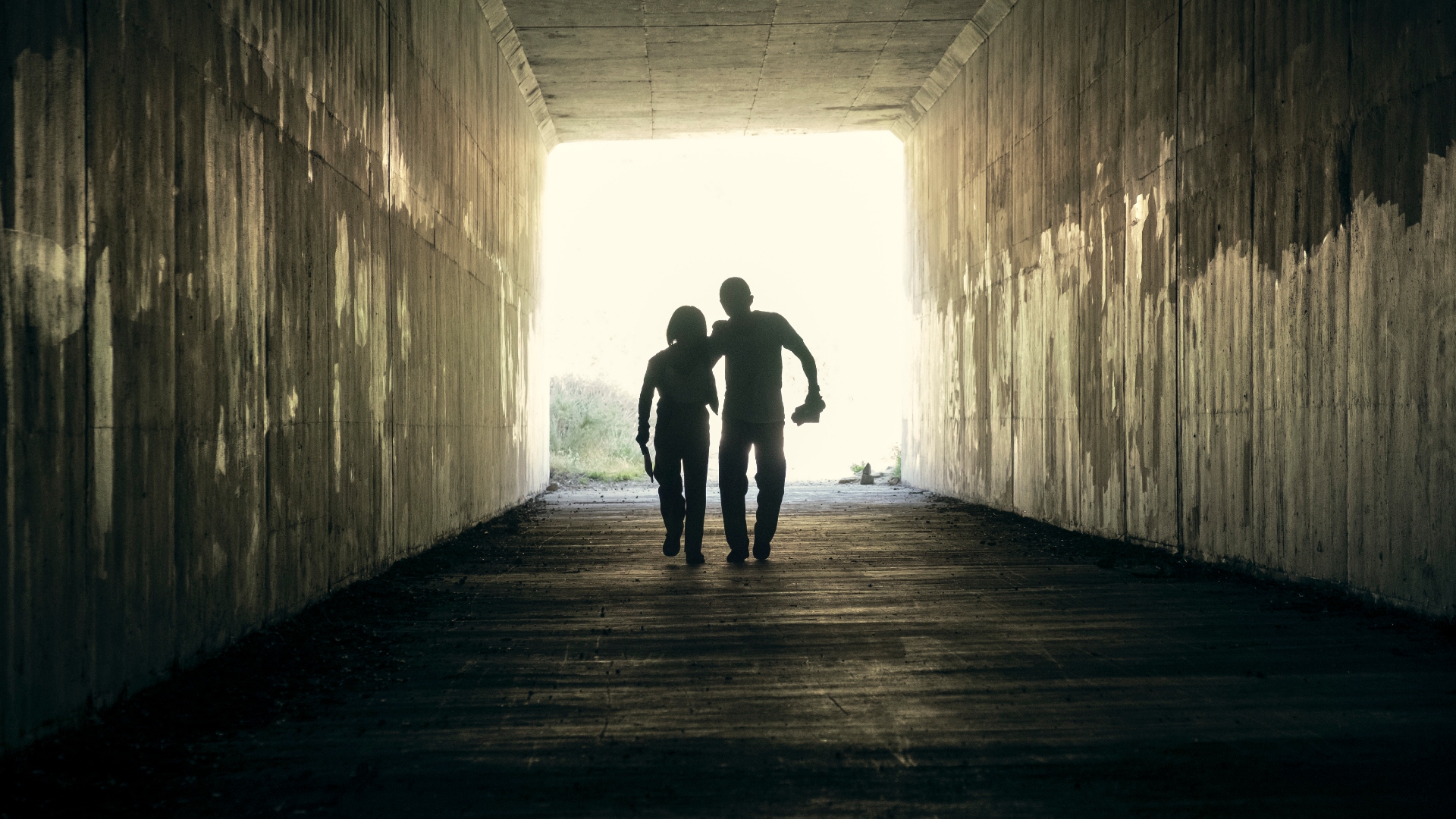 Danny and Amy walk down a tunnel together in Beef season 1