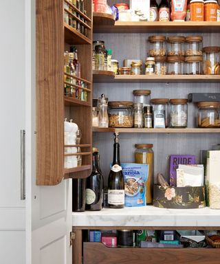 pantry filled with glass canisters and food containers