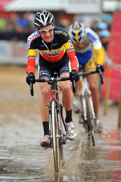 Albert chases through the puddles with Bart Wellens behind
