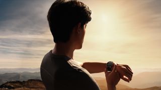 An athletic man stands with the sun behind him, holding his OnePlus Watch 3 while cueing up an "Outdoor fat burn run" with the screen showing a map.