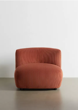 Sitting chair in a rust hue.