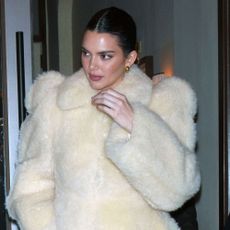 Kendall Jenner wears a white coat