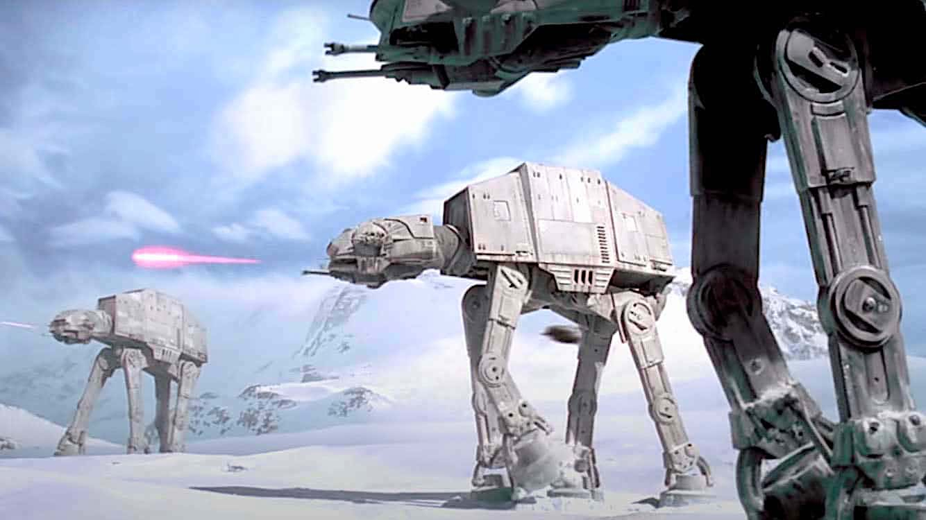 Giant armored troop carriers cross a snowfield