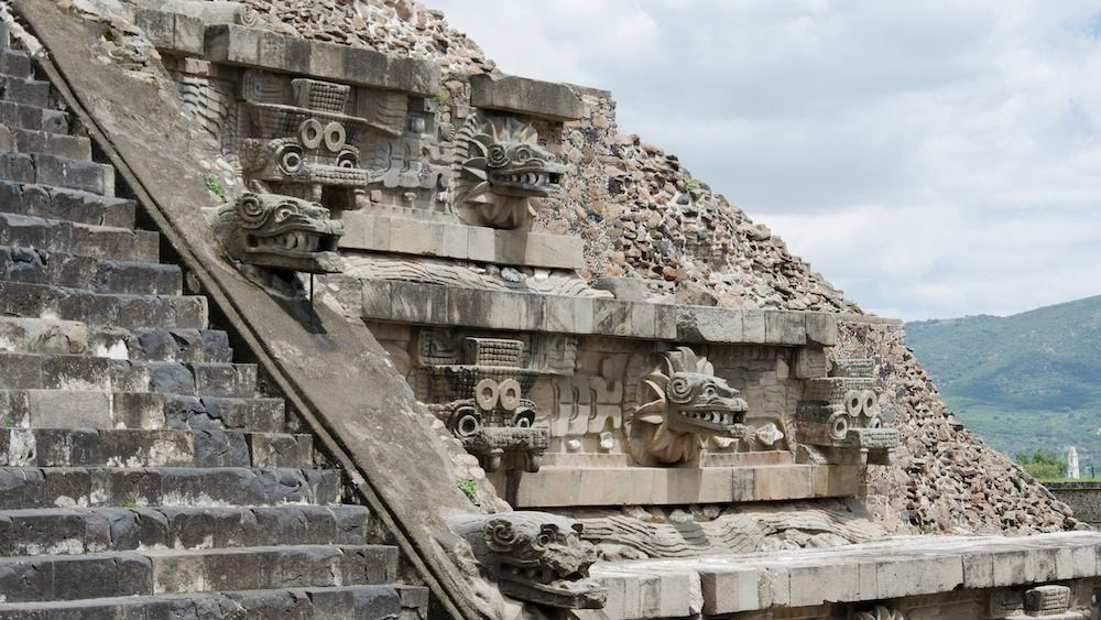 An ancient stone temple with carvings and stairs