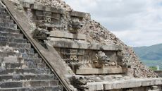An ancient stone temple with carvings and stairs