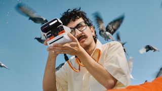 Photographer using a Polaroid Flip