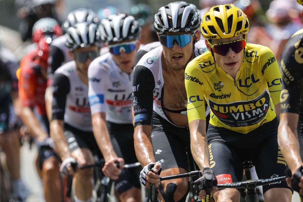 Jumbo-Visma's Danish rider Jonas Vingegaard (R), UAE Team Emirates' Italian rider Matteo Trentin (2nd R) and UAE Team Emirates' Slovenian rider Tadej Pogacar wearing the best young rider's white jersey (C) cycle in Cormet de Roselend during the 17th stage of the 110th edition of the Tour de France cycling race, 166 km between Saint-Gervais Mont-Blanc and Courchevel, in the French Alps, on July 19, 2023. (Photo by Thomas SAMSON / AFP)