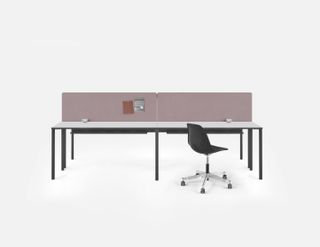 Two desks on wheels that can be joined together to create a larger work area.
