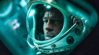 Brad Pitt wears an astronaut helmet in Ad Astra 