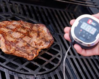 steak on the Grill with a meat thermometer