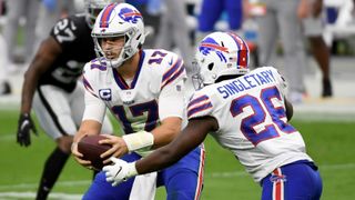 Quarterback Josh Allen of the Buffalo Bills hands the ball off to running back Devin Singletary in a game against the Las Vegas Raiders on October 4, 2020 in Las Vegas. He'll look to keep his team undefeated Tuesday.