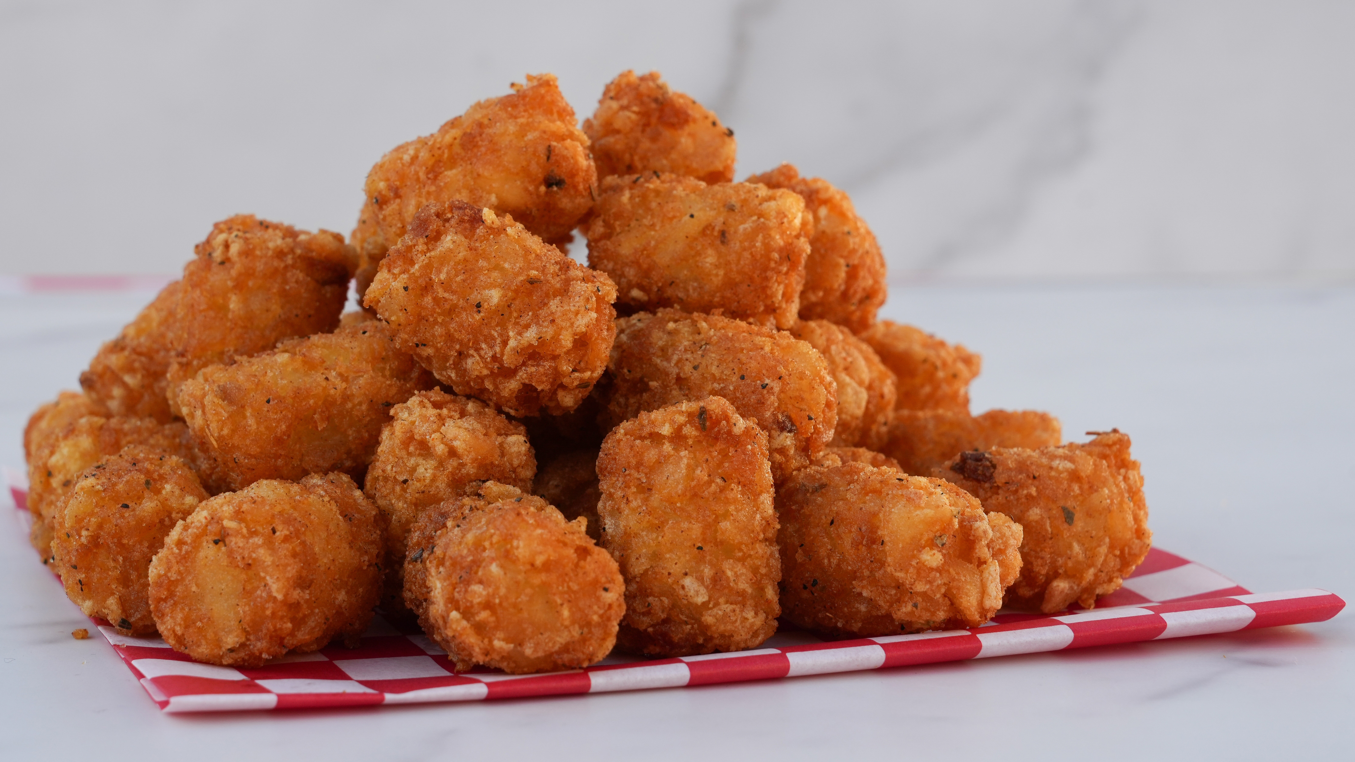 tater tots on a marble background