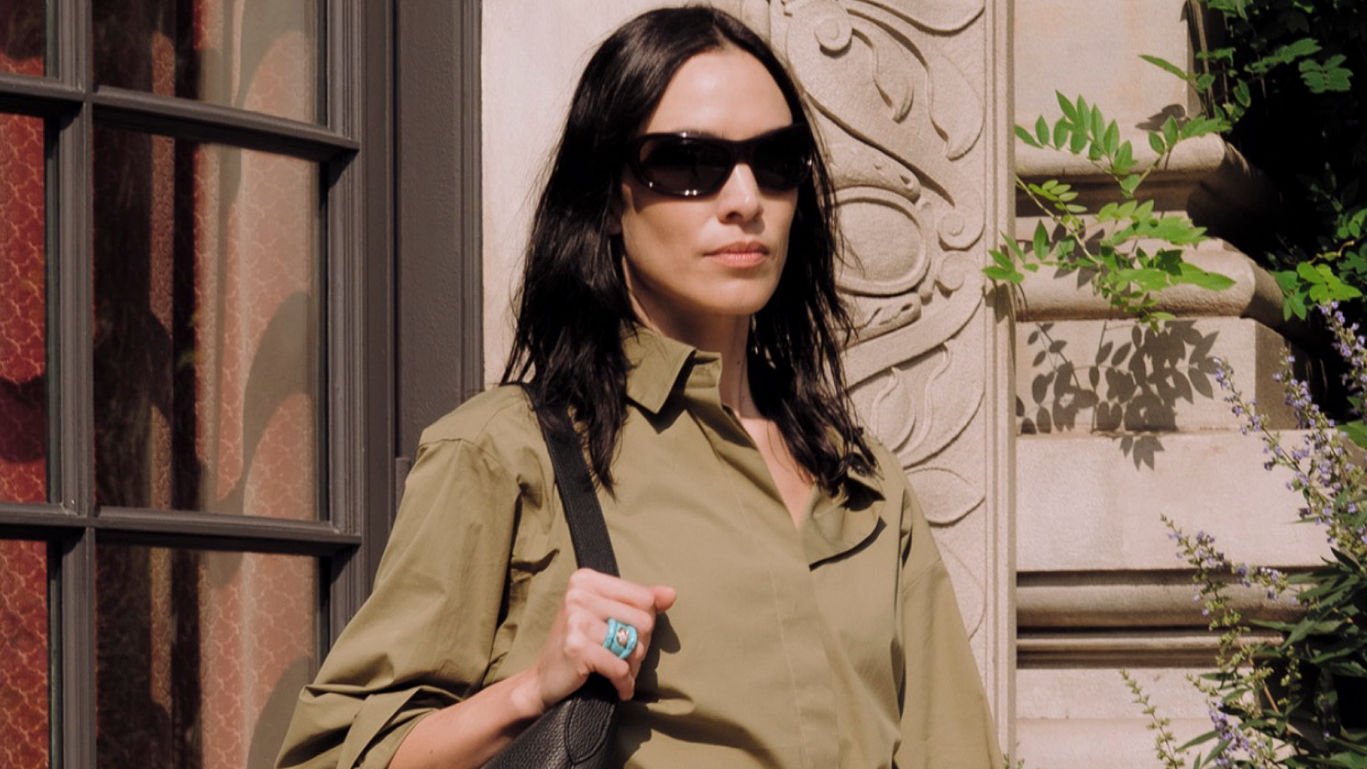 Alexa Chung wore the Bermuda shorts trend in olive green with peep-toe pumps