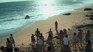 Mrs. Davis' followers on a beach in the show's trailer