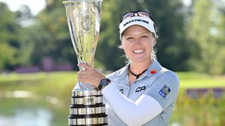 Brooke Henderson holding a trophy after winning the 2022 Evian Championship