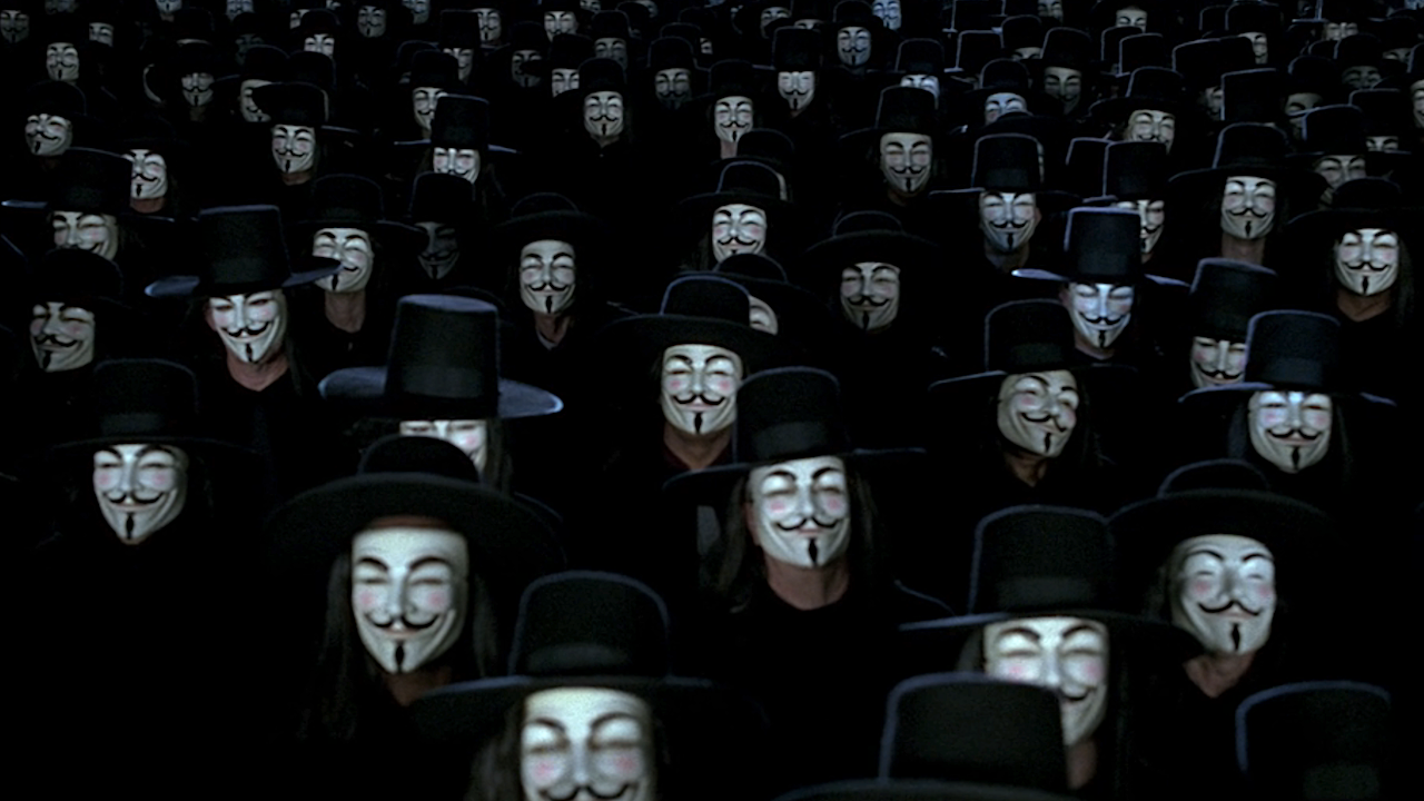 Crowd of people wearing V masks in V For Vendetta