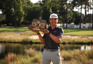 Garrick Higgo holds the Palmetto Championship trophy