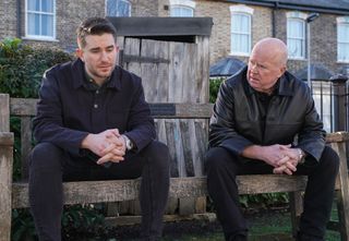 Phil Mitchell and Callum Highway on the park bench in Albert Square