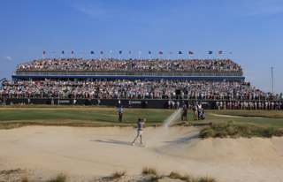 Bryson DeChambeau plays a bunker shot